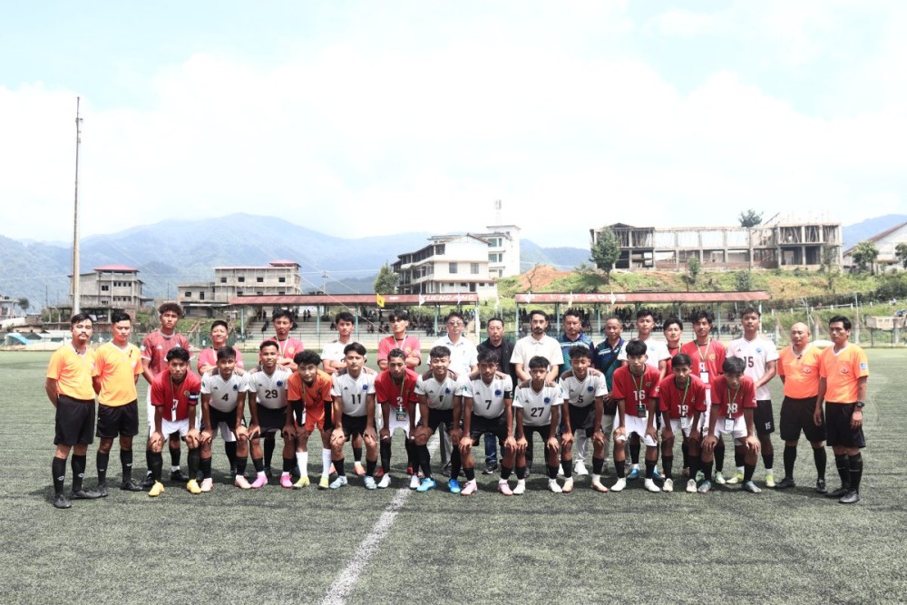 Players of Khulioh King FC (white) and Mt Pongen FC pose for a photo during the inaugural match of the 2nd Tuensang District Football Association (TDFA) League 2026 held at the Loyem Memorial Astro Turf, Tuensang on June 28.